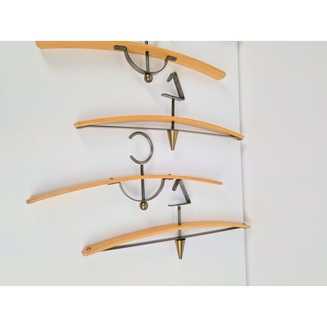 Postmodern coat hangers brass, bentwood, 1980 set 7 Set 7 Clothes Hangers. Bentwood brass. Hollywood regency. Dimensions:...