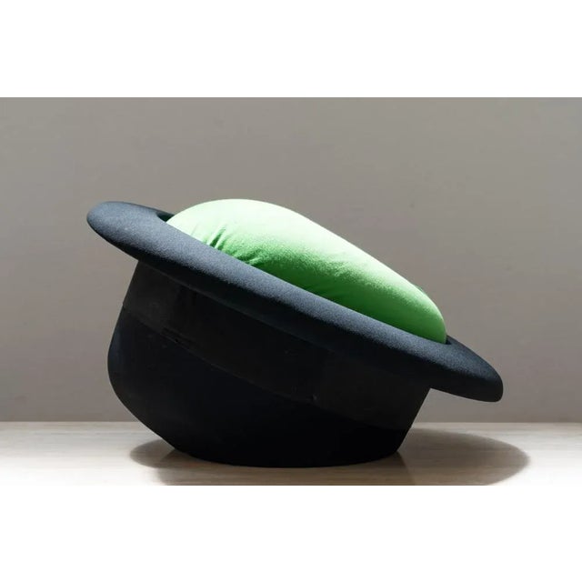 Landing-off armchair to surrealism. The green apple and the black bomb are recurring figurative elements in the works of...