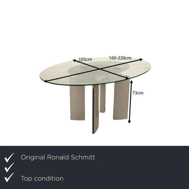 Ronald Schmitt's glass and metal dining table is an extravagant addition to any modern dining room. The round tabletop can...