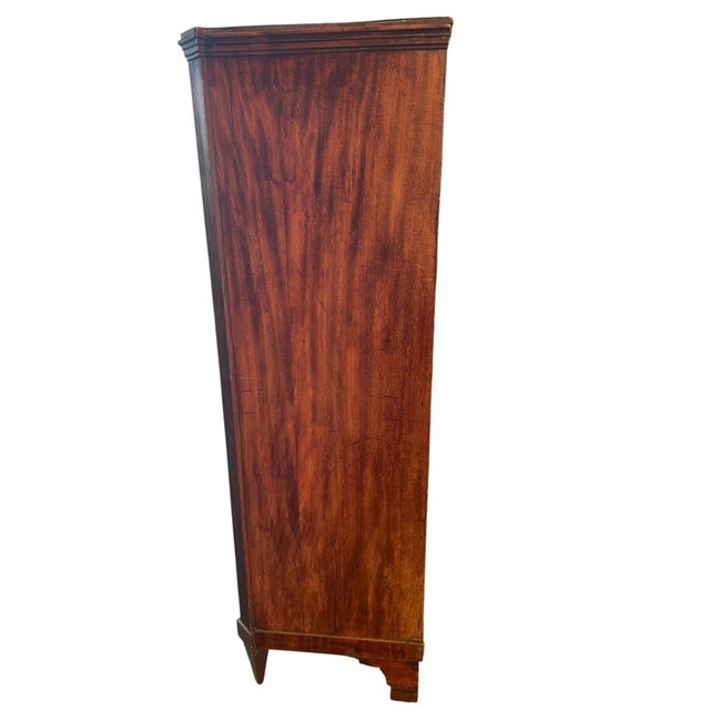 The mahogany chest is entirely original and made of solid oak veneered with prime quality mahogany. The elegant brass...