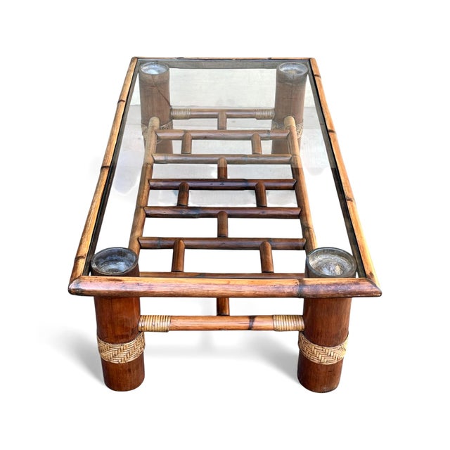 This vintage bamboo coffee table features a classic rectangular silhouette with a warm provincial-toned finish that...