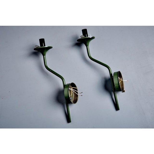 Italian mid-century wall sconce with one globes by Goffredo Reggiani for Lampadari Reggiani, Monza. The design features...