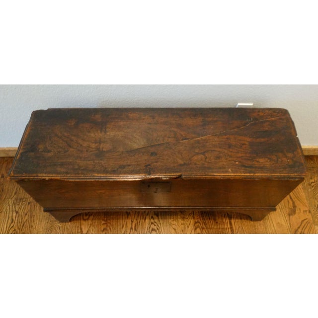 Lovely handcrafted late 18th-Century English George III solid elm coffer with hinged lid. It is a six board chest, simple...