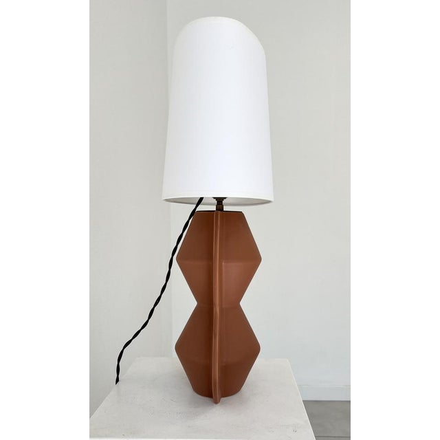 “Africanist” table lamp in enamelled terracotta, France circa 1990 European Plug (up to 250V).The wiring of this item may...