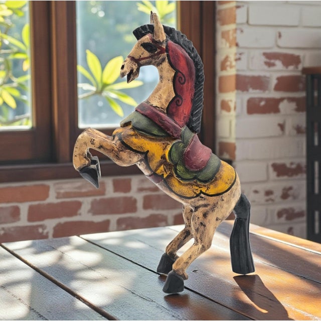 This large hand-carved wooden horse was produced in Mexico and reflects traditional folk art carving practices. Measuring...