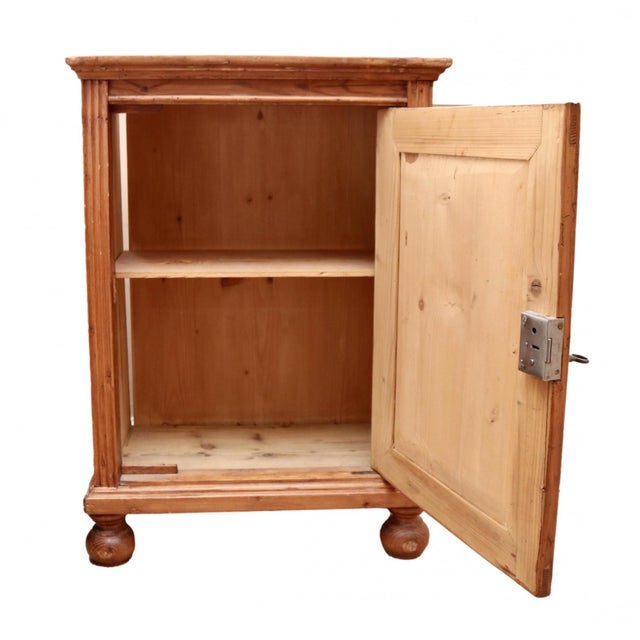A well-crafted, small scale English side cabinet or nightstand with a single right-handed door, one interior shelf and...