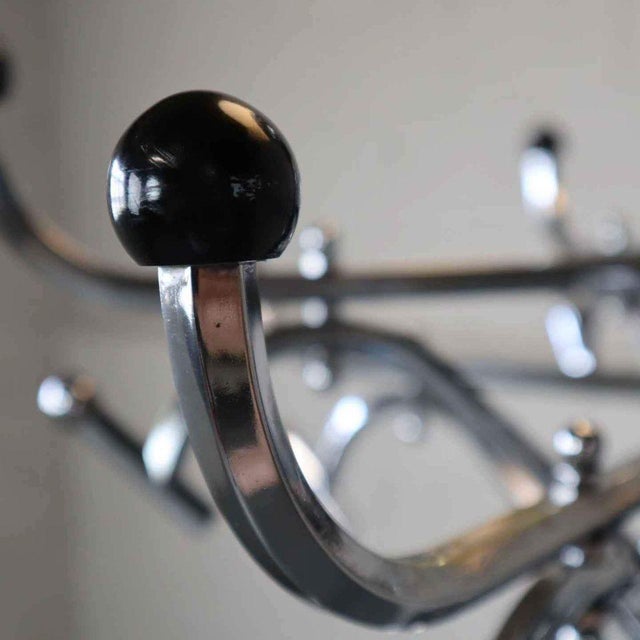 Impressive large Art Deco chrome coat rack/floor lamp. Early 20th century. The coat rack/floor lamp consists of clustered...