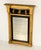 A fine period English pier mirror from the Regency era - often categorized as an Empire mirror - with gilt and ebonized...