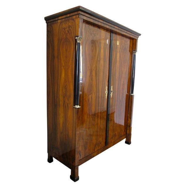 Elegant original Empire / early Biedermeier Armoire in walnut veneer and brass fittings from Austria, Vienna around 1815....