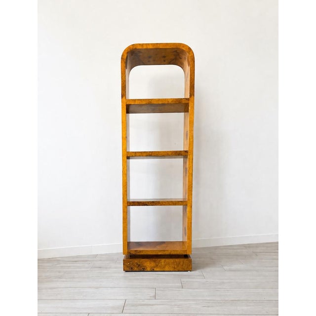 Unique 1980s American Art Deco-style modular bookcase, entirely made of lacquered blond mahogany burl. Dimensions: W 59.5...