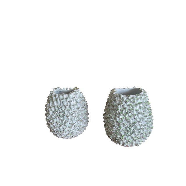 A charming and highly tactile pair of vintage Italian ceramic vases that beautifully bridge mid-century coastal flair with...