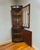 A gorgeous corner cabinet Made in England, wonderful mahogany wood. The upper curved door has individual arched glass...