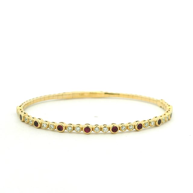 An elegant American-attributed ruby and diamond bracelet dating to the late 20th century. Crafted in polished 14-karat...