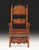Antique Italian Baroque armchair handcrafted from solid walnut and richly decorated with hand-carved details throughout....