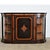 A spectacular cabinet/credenza from England circa 1850, displaying many of the audacious characteristics as the Third...