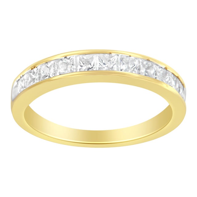 Embrace timeless elegance with this captivating 14 karat yellow gold band ring, where luxury meets simplicity in perfect...