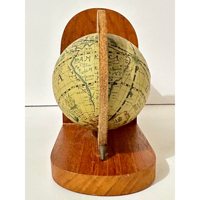 Pair of vintage Old World globe shaped bookends made from wood and paper-mache. Made in Hong Kong during the mid-to-late...