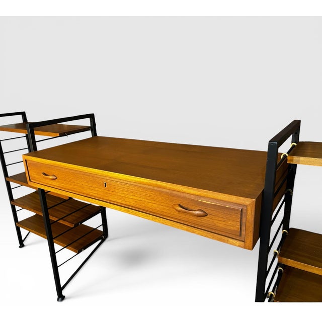 A beautifully proportioned mid-century modular Ladderax desk and shelving system by Staples, England, dating from the...