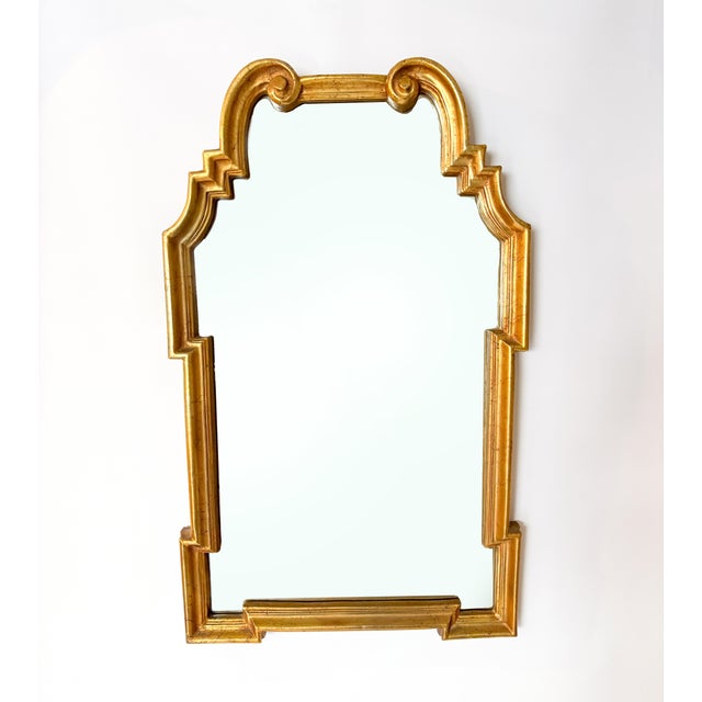 This stunning LaBarge-style mirror, finished in gold leaf, embodies a timeless Neoclassical aesthetic. The frame features...