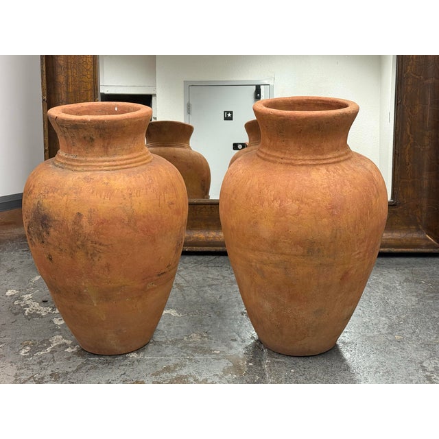 Design Plus Gallery presents a Pair of Italian Terracotta Outdoor Pots. These vessels have a classic amphora inspired...