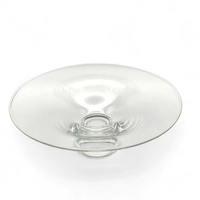 The “Magnolia” centerpiece crystal bowl was designed by Joel Smith, and introduced in 1994 for Steuben (#8741). It...