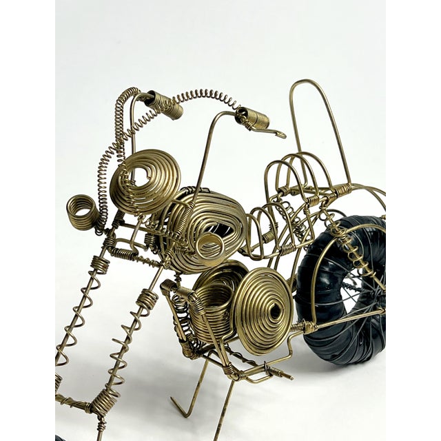 Killer vintage wire motorcycle sculpture. I am seeing some listed on Dibs and other sources saying it's Curtis Jere but...