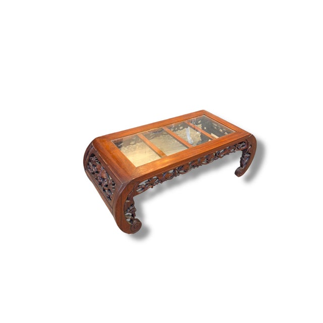 Vintage Asian-inspired carved wood side table with elegant openwork detailing and inset glass top. This beautifully...