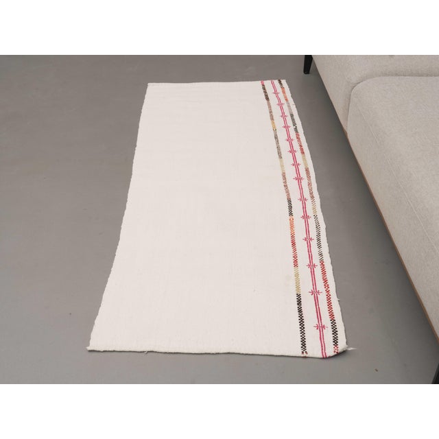 Vintage Hand-Knotted runner rug is a semi-antique vintage area rug. The '70s Eastern region of Anatolia's unique rug is...