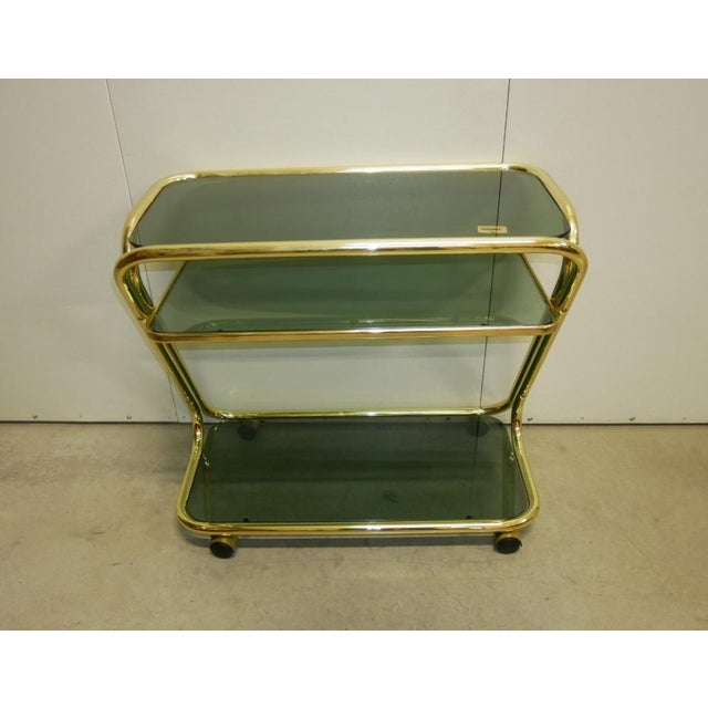 Brass food trolley from the 1970s. Marcato morex three-tier brass trolley, three smoked glass shelves. italian modernism...