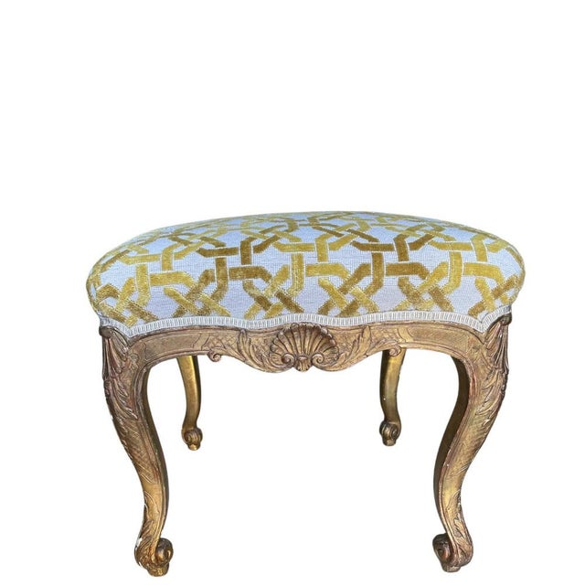A pair of refined French giltwood tabouret, possibly dating to the mid-18th century, exemplifying the elegance and...