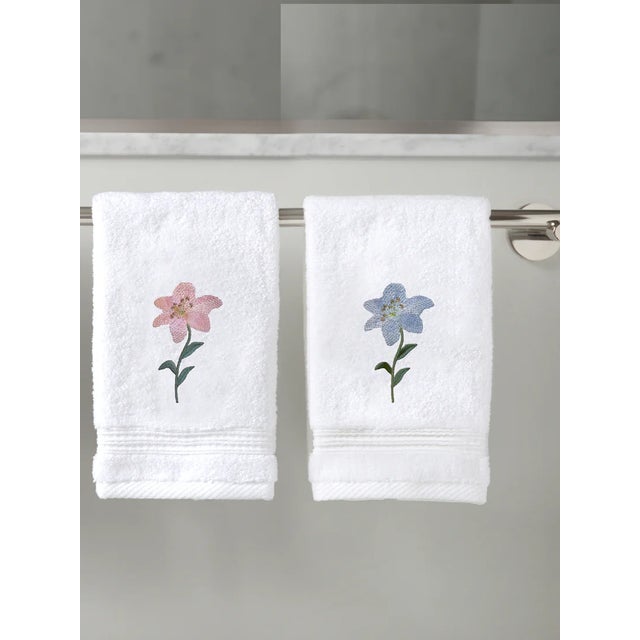 Our 100% Cotton Terry Guest Towels are durable, soft to the skin and super absorbent. The Starburst Lily embroidered terry...