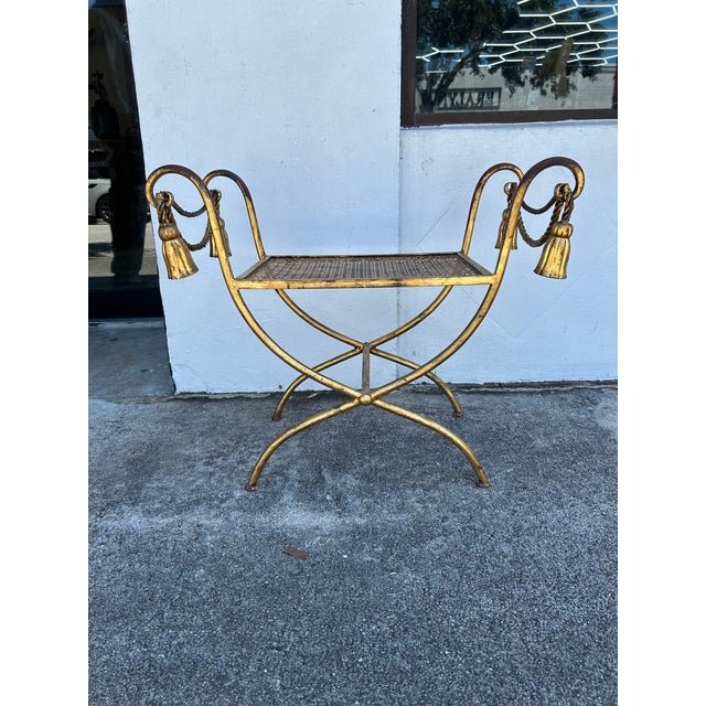 Chic vintage Italian bench crafted in metal in a classic rope and tassel form with a guilt finish now worn to perfection.