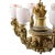 Antique Italian Art Nouveau gilt wood chandelier with six scroll design arms and alabaster shades, circa 1910. Dimensions...