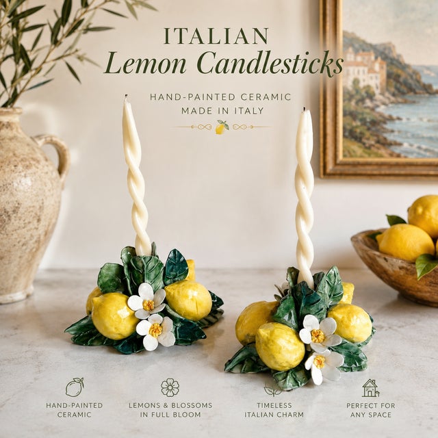 Charming vintage ceramic candlesticks featuring hand-painted lemons, lemon blossoms, and lush green foliage in a vibrant...