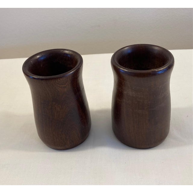 Very nicely turned rosewood cups. Most likely turned from a single block of wood. Dimensions: 2.5" diameter x 4" tall