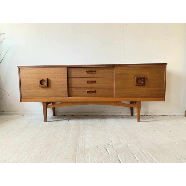 The Teak Mid Century Sideboard Mogens Kold is an exceptional piece of Danish mid-century modern furniture. Its simple yet...