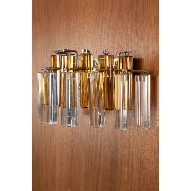 Novaresi wall lamp made from amber coloured and clear murano glass. It is a heavy lamp so we advise to mount it to a solid...