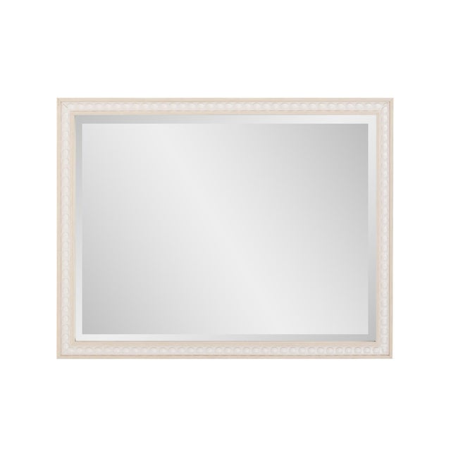 The Beaded Mirror features a timeless design with a delicate beaded border. Its neutral finish and sophisticated detailing...