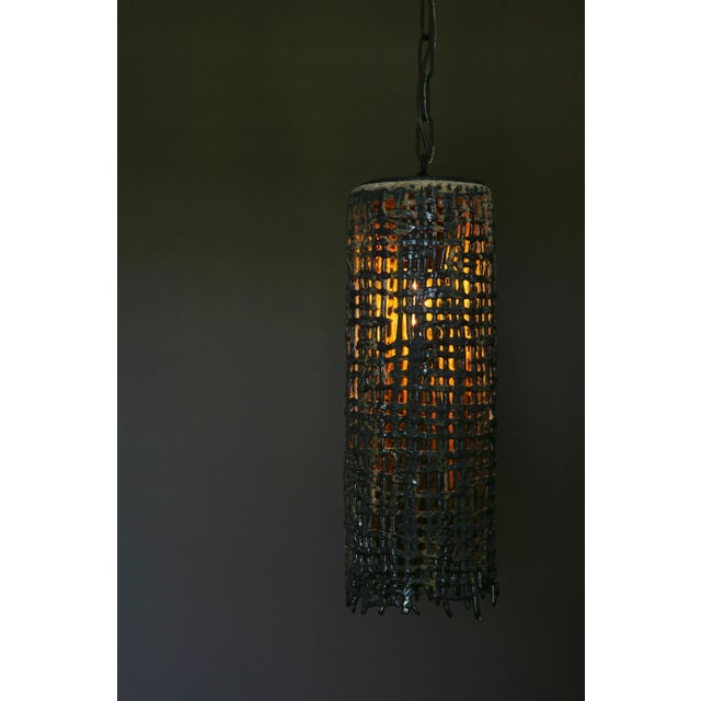 Materials: Hand-built glazed stoneware, old iron chain and canopy White clay body with verdigris glaze 6.25” w x 6.25” d x...