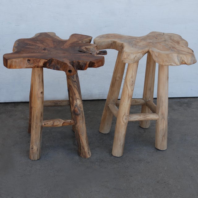 Pair of 22" rustic live edge stools One lighter wood, and one is a medium-dark wood. Both are about 2ft. tall, and feature...