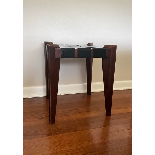 Up for sale is a rare teak and woven leather stool or ottoman from Edmond J. Spence. This rare piece will be a great...