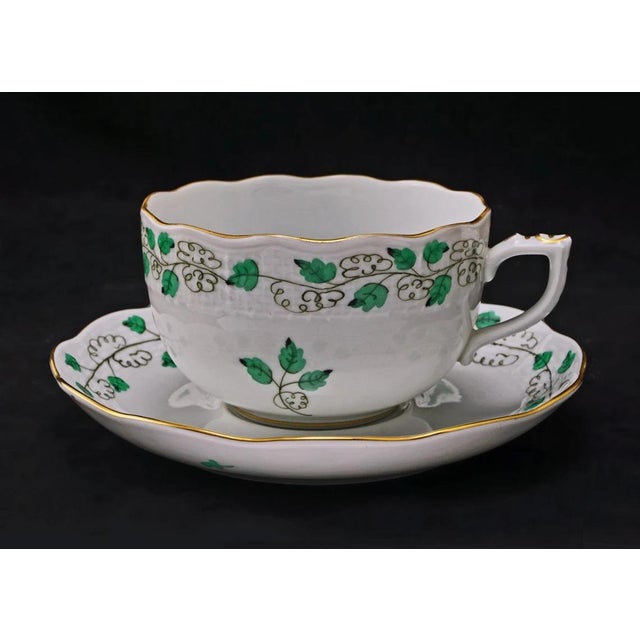 Herend Sabina Vert trio of cup, saucer and plate set with scalloped gilt edges and raised relief borders. Pieces are...