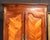 A beautiful and generously proportioned 19th-century French Provincial walnut armoire, featuring elegant Louis XV-inspired...