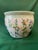 This vintage medium, hand painted porcelain chinoiserie koi pot features a pink rose background adorned with multi color...