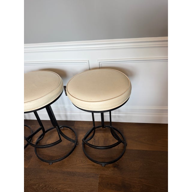 An exceptional set of four vintage swivel bar stools by Shaver-Howard, the celebrated North Carolina maker renowned for...