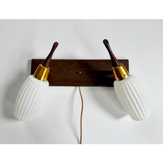 Beautiful mid century double wall sconce. Plug in cord makes it easy to install anywhere.