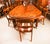 This is a fantastic vintage Victorian-style marquetry dining set, comprising a gorgeous burr walnut and marquetry dining...