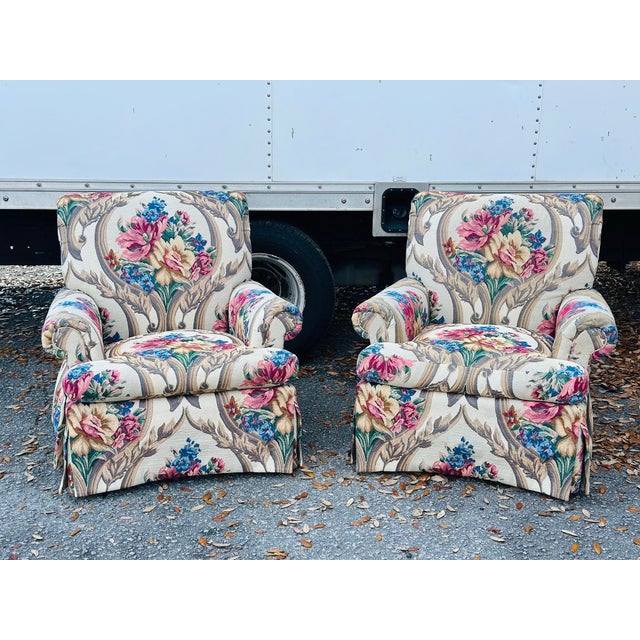 Brief description: Pair of traditional upholstered club armchairs by Vanguard Furniture (Hickory, North Carolina). These...