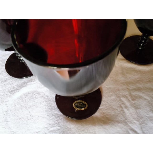 Elevate your holiday tablescape with this rare set of 12 vintage (1940's-50's) Mid-Century modern Royal Ruby Red stemmed...