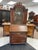 For sale is a unique antique secretary desk. The desk has a large front glass center door with a brass mesh screen behind...